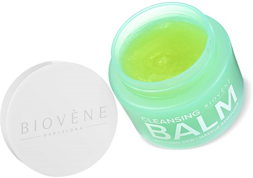 A green jar of Biovène cleansing balm with a white lid nearby.