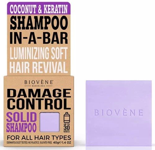 Box packaging for Biovène Damage Control solid shampoo with purple and beige colors, promoting hair softness and damage control.
