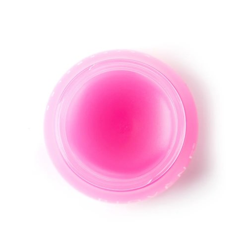 A pink, circular container with a smooth top surface, viewed from above.