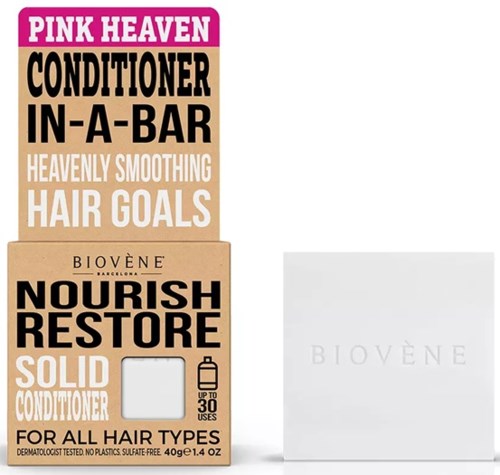Boxen mit pinken und beigefarbenen Haarpflegeprodukten mit fettgedrucktem schwarzen und weißen Text. Enthält eine kleine weiße Box.
