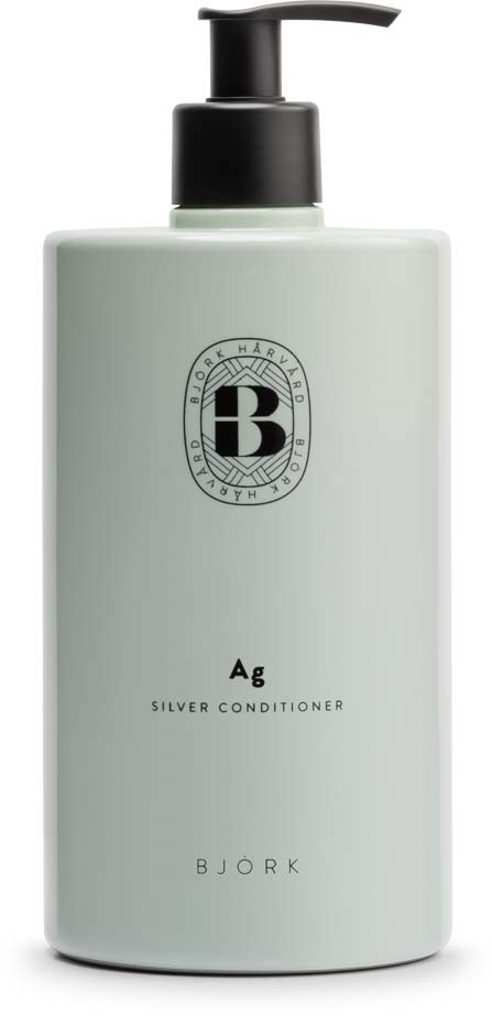 Eine weiße Flasche mit schwarzem Pumpkopf, beschriftet mit Bjork Silver Conditioner, mit Logo und Text.