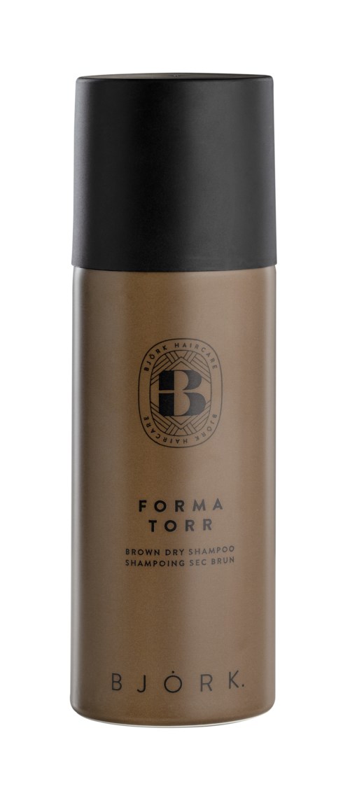 Ein runde Flasche mit schwarzem Verschluss, beigen Körper, Bjork-Logo, als Trockenshampoo gekennzeichnet.