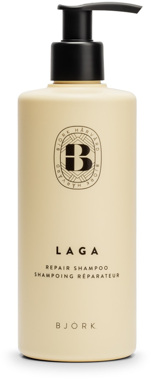 Eine beige Shampoo-Flasche mit schwarzem Pumpkopf, mit "LAGA" und "Bjork" etiketti.