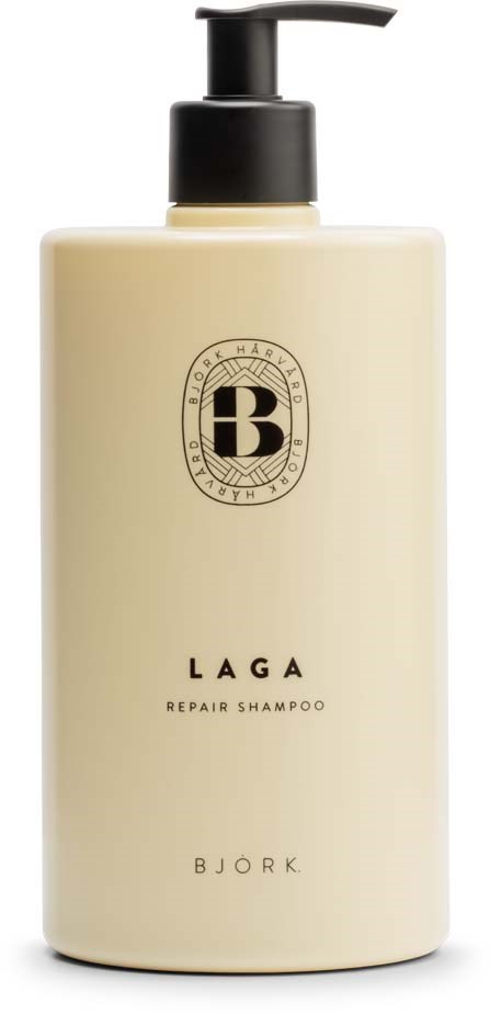 Eine beige Flasche mit schwarzem Pumpaufsatz, beschriftet 'LAGA Repair Shampoo' von Bjork.
