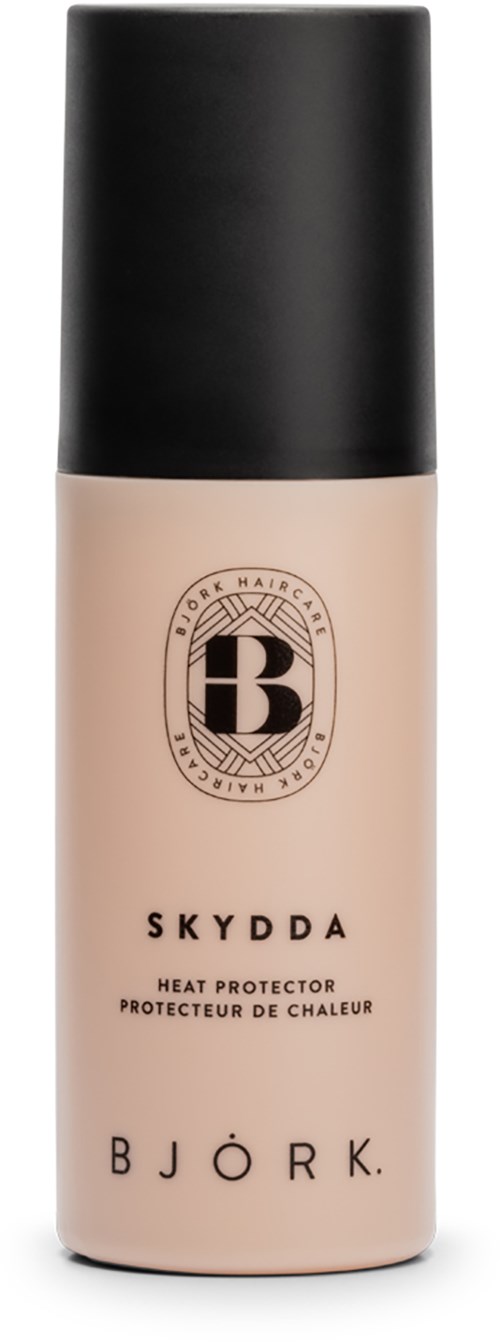 Eine beige Flasche mit schwarzem Deckel und Logo, namens Skydda, von Bjork, für Hitzeschutz.
