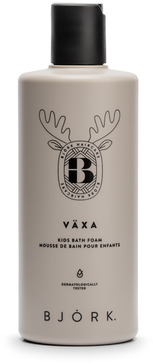 A white bottle with a black cap, featuring a reindeer logo, labeled as kids bath foam from Björk, allergy tested.