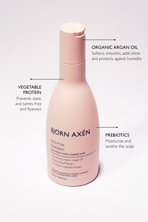 Flessen met voordelen van biologische arganolie, plantaardig eiwit en probiotica. Bevat shampoo voor kroes en kroeshaar.