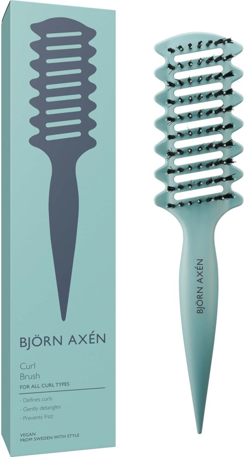 Een teal haarborstel met een gekrulde, spikes vorm en een bijpassend doosje dat het promoot als zacht en geschikt voor alle krultypes.