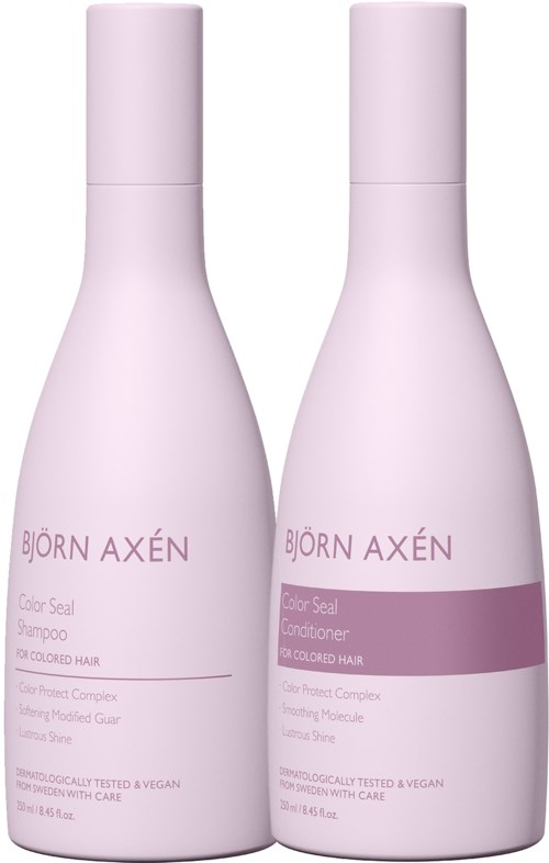 Twee witte flessen, één voor shampoo en één voor conditioner, gelabeld met merk en doel, voor haarverzorging.