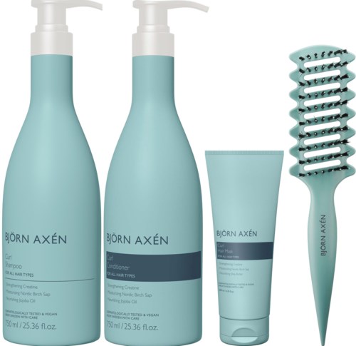 Set van vier haarverzorgingsproducten van Björn Axén: twee flessen met pomp, een tube en een krullenkam.