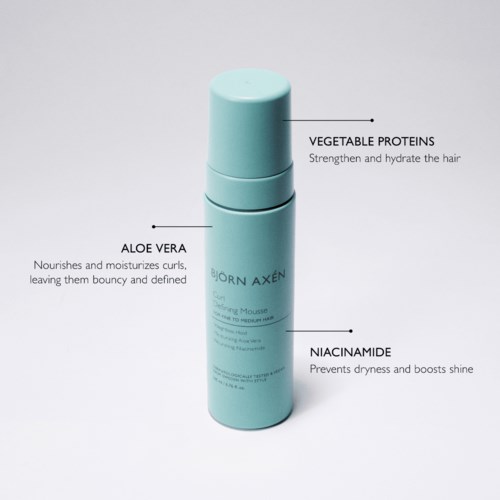 A light blue bottle highlights ingredients like vegetable proteins, aloe vera, and niacinamide for hair care.