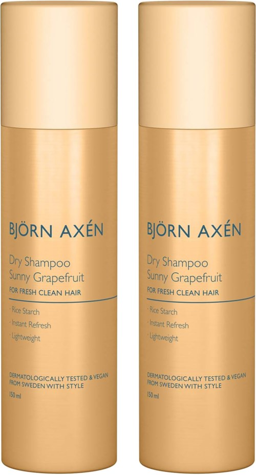 Twee flessen Björn Axén droogshampoo met zonnige grapefruitgeur. Ze zijn beige met blauwe tekst.