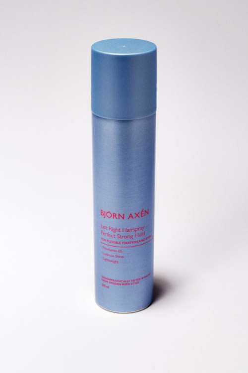 Een blauwe cilindervormige fles met dop, gemerkt 'Born Axen,' waarschijnlijk een huidverzorgingsproduct.