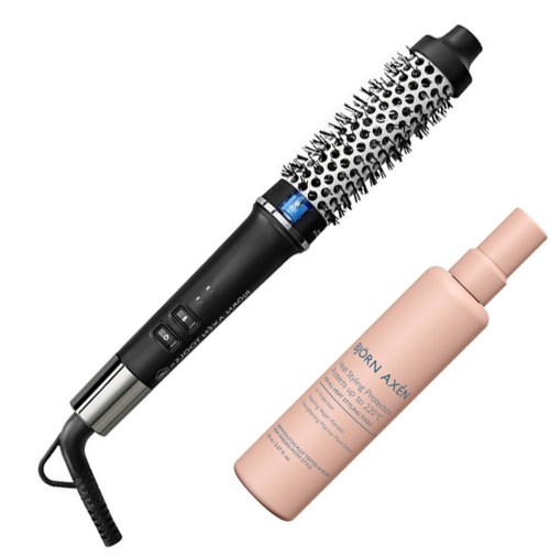 Eine runde Haarbürste und eine rosa Flasche Haarspray sind zusammen.