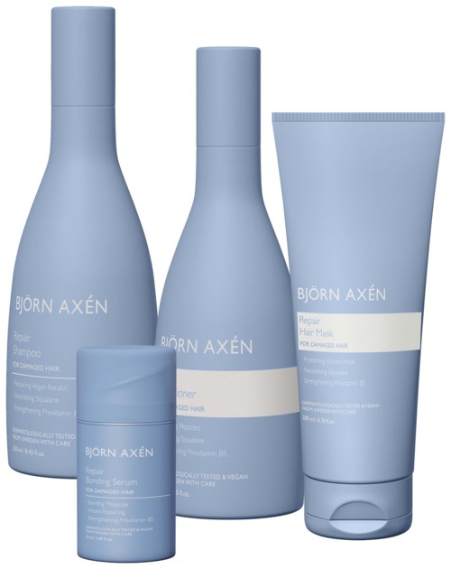 Vier lichtblauwe haarverzorgingsflesjes en een tube, gemarkeerd met 'Björn Axén', waarschijnlijk haarproducten. Eenvoudig ontwerp, allemaal in dezelfde kleur.