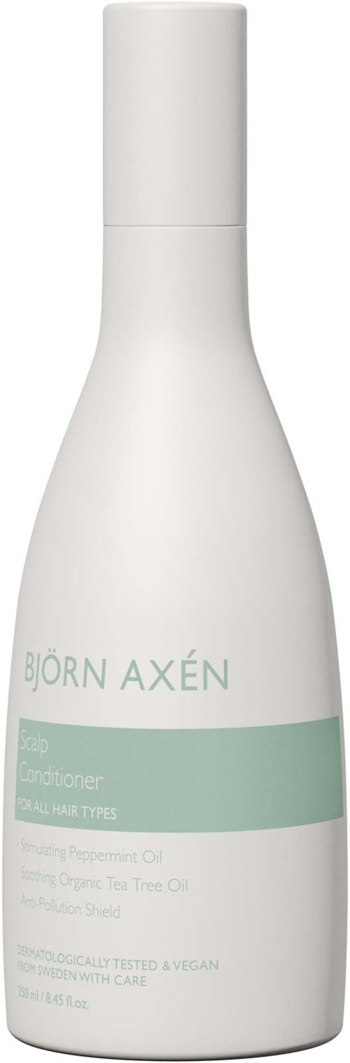 Een wit flesje met een pomp, labeled Björn Axén conditioner voor alle haartypes, bevat organische plantaardige ingrediënten.