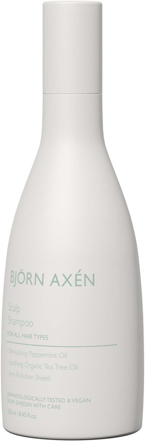 Een witte plastic fles met een eenvoudige label die "Björn Axén" zegt en enkele productgegevens voor shampoo.