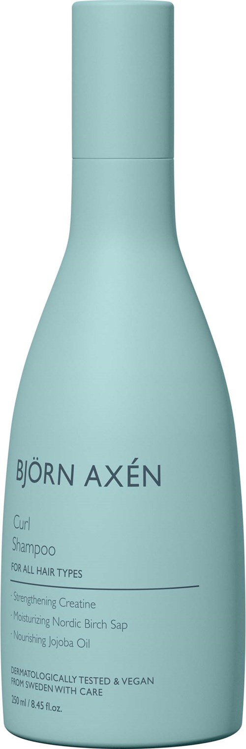 Lightblauwe fles voor Björn Axén Curl Shampoo voor alle haartypes, met tekst over ingrediënten en verzorging.