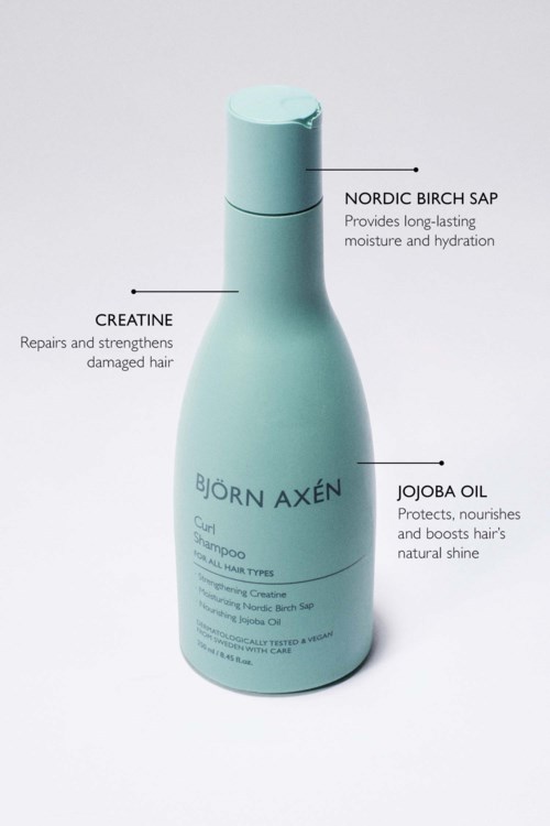 Fles met Bjorn Axen haarverzorging met ingrediënten voor vocht, herstel en voeding.