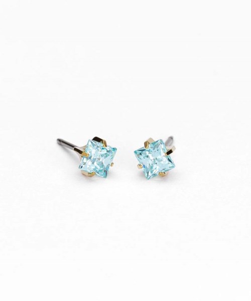Silver earrings with blue gemstones in square settings. Simple and elegant jewelry accessory.