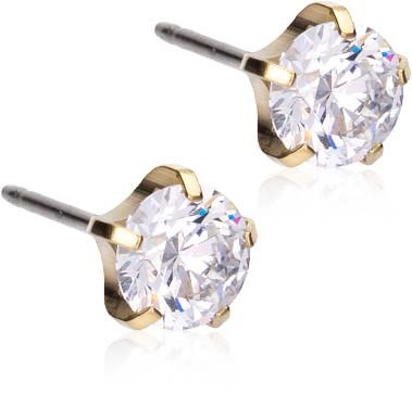 A pair of stud earrings with large clear stones and gold settings.