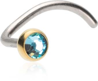 A curved silver nose ring with a blue gemstone in a gold setting.