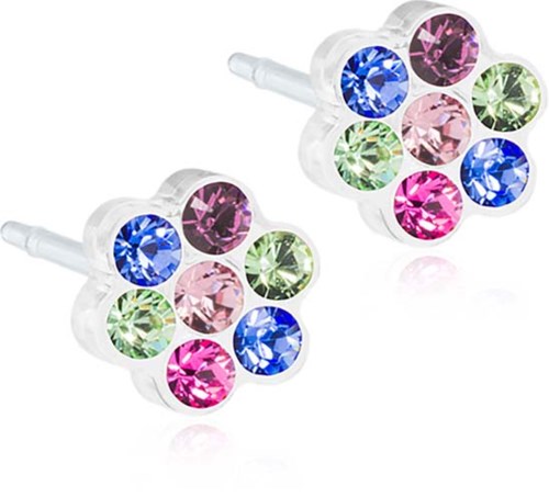 Fargede rhinestones er arrangert i stjernelignende former med klar plastbakgrunn.