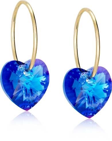 Gold hoop earrings with large blue heart-shaped gemstones. The earrings dangle freely.