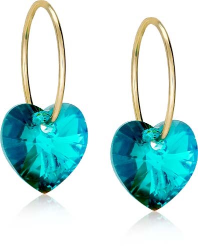 Silver earrings with large blue heart-shaped gemstones and thin gold hoops.