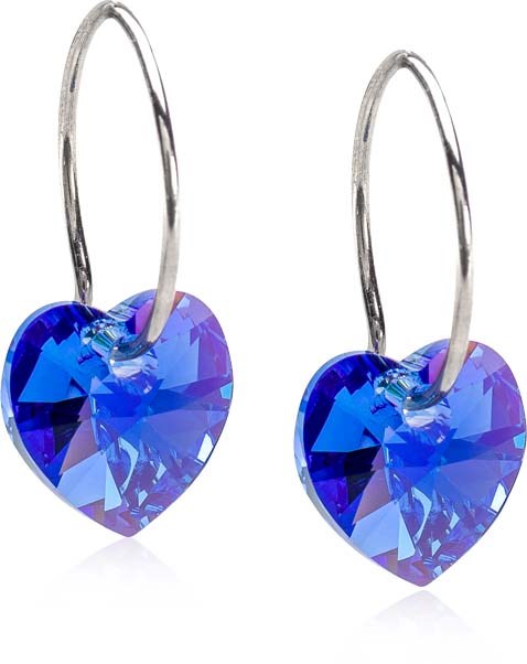 Heart-shaped blue crystal earrings with silver hooks. They are shiny and decorative.
