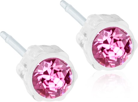 Pink gemstones on clear studs, possibly earrings, with metal posts. Simple and shiny design.