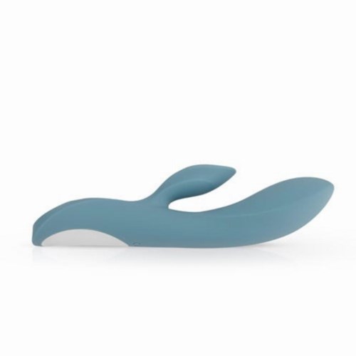 A blue, ergonomic object shaped like a whale with a tail, possibly a toy or a massager.