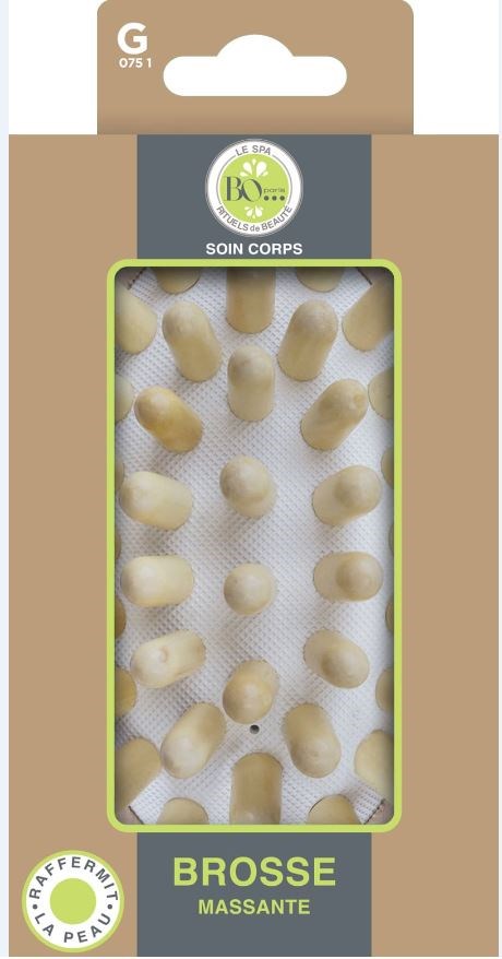 Box containing soft, rounded massage brushes with small wooden handles for skin care.