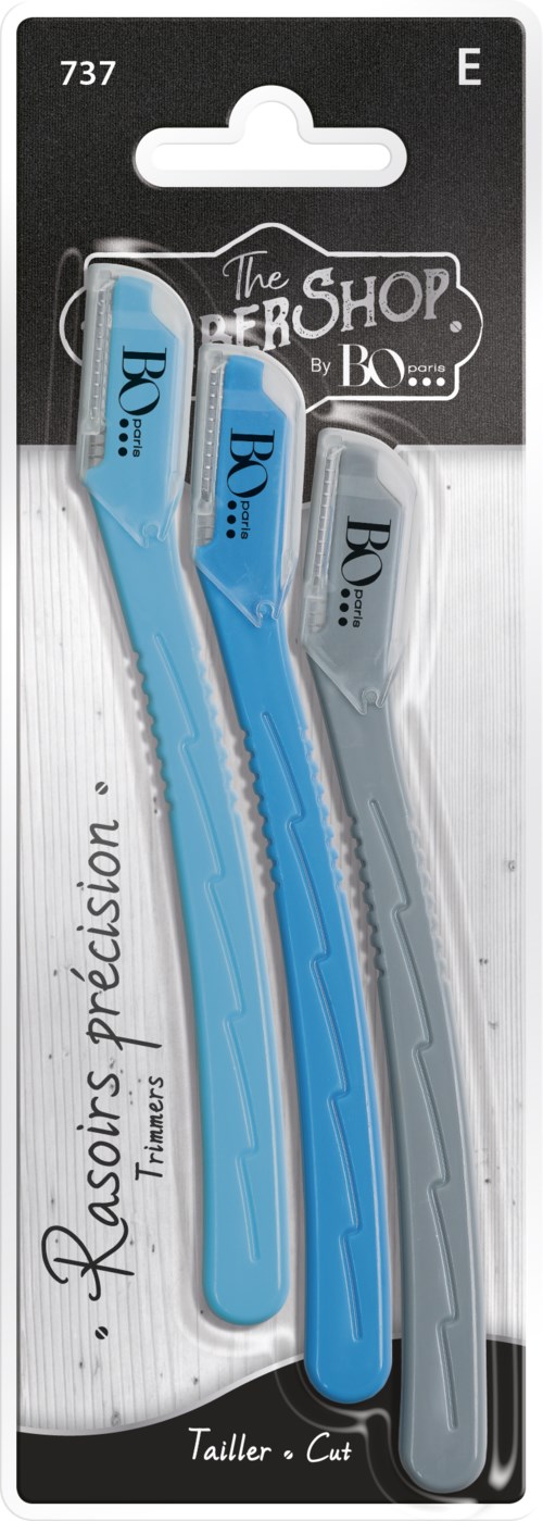 Three blue and gray razor blades in a store package, labeled for trimming and cutting.