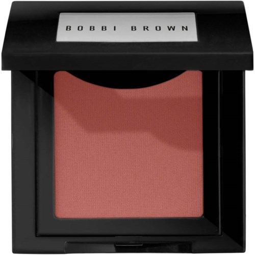 A square blush in a black compact case with a clear window and Bobbi Brown branding on the lid.