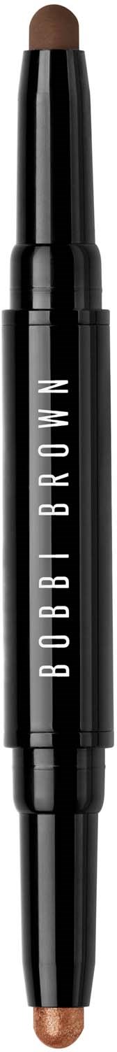 A dual-ended makeup stick with a neutral shade, black body, and white text. It appears to be a concealer or highlighter.