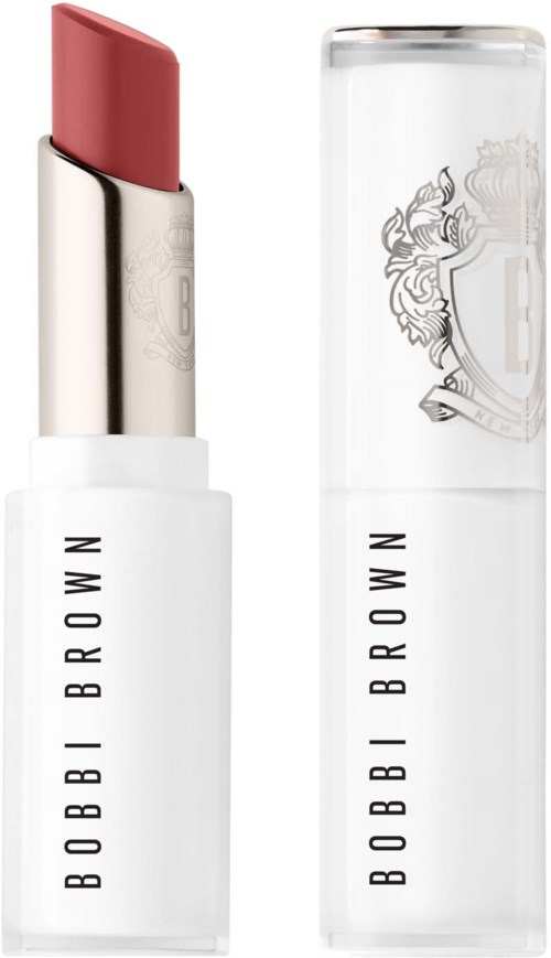 A pink lipstick in a white tube with black text, next to a transparent cap with a logo.