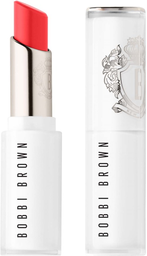 A white lipstick tube with a red lipstick and a clear cap with a logo. The lipstick is partially extended.