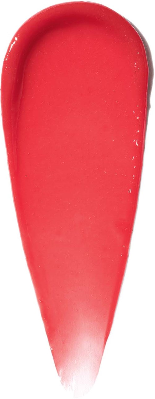 A red, curved, iced dessert in a spoon shape. It looks smooth and glossy.
