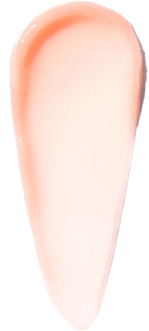 A soft, peach-colored beauty blender with rounded edges, designed for makeup application.