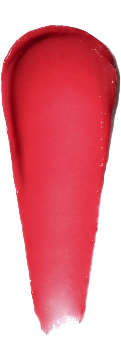 A smear of bright pinkish-red lipstick with a smooth texture on a white background.