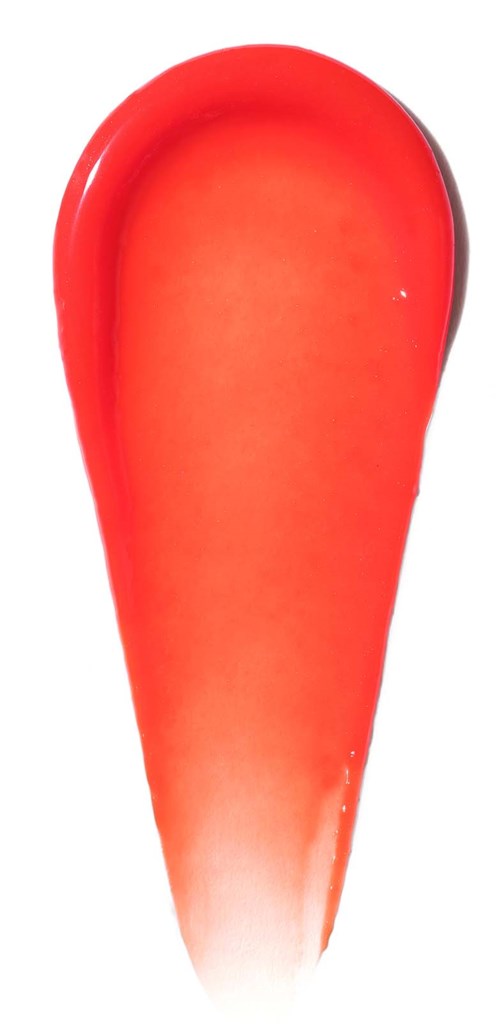 A red spatula with a rounded edge and a white handle. It looks like a kitchen tool.