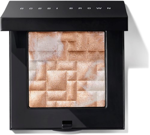 A makeup compact with beige and light brown shades, inside a black case marked with "BOBBI BROWN."