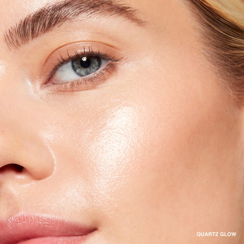Close-up of a woman's face showing clear skin, blue eye, and part of a cheek with smooth texture.