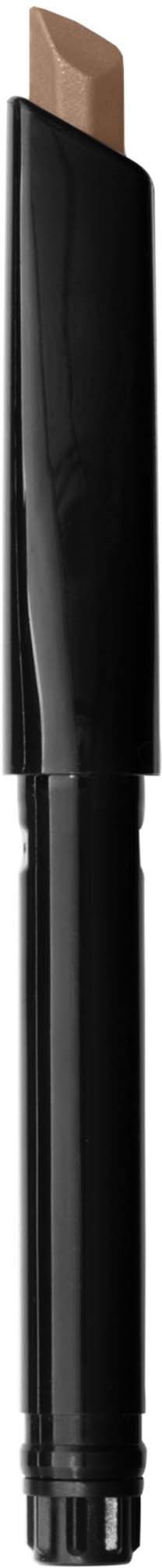 A makeup concealer stick with a black and silver case and a beige product at the top.