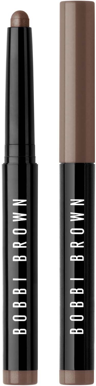 Two Bobbi Brown makeup sticks, one with a brown shade and one with a brownish-tan shade.