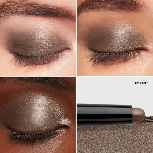 Close-up of eyes with shimmery, natural eyeshadow in different skin tones, and an eyeshadow stick labeled "FOREST".