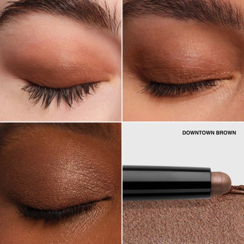 Close-up of three eyes with different eye shadow colors and an eye shadow stick labeled "DOWNTOWN BROWN."