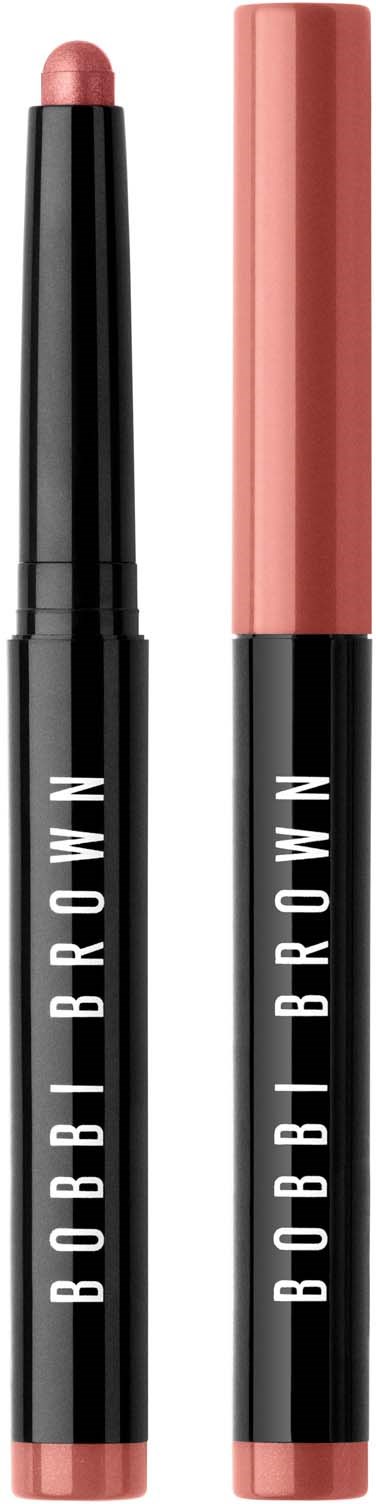 Two Bobbi Brown makeup sticks, one with a pinkish color and one with a cap. They are standing upright.