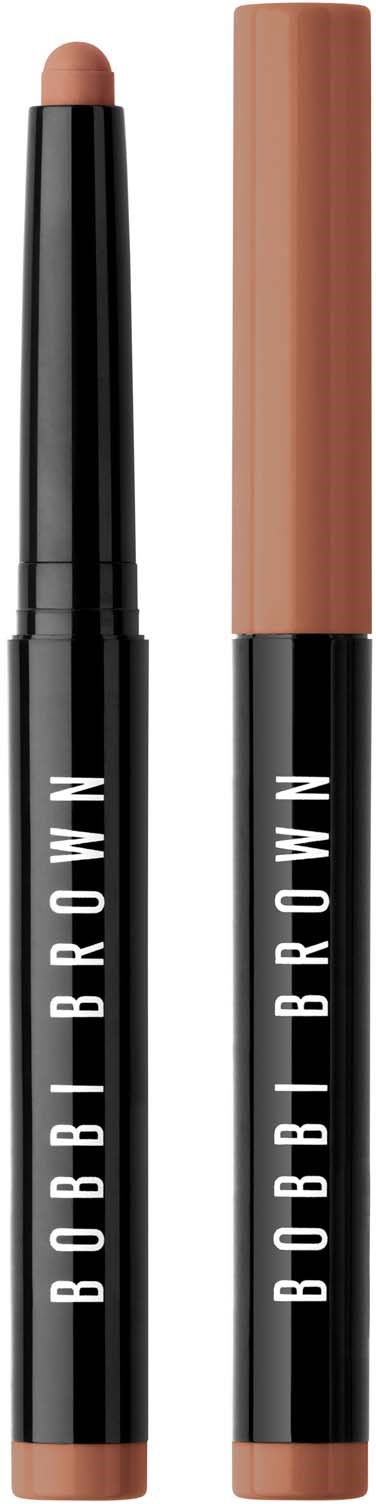 Two makeup sticks, one with a beige top and the other with a brown cap, labeled 'BOBBI BROWN' on black bodies.